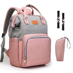 a pink and grey backpack next to a bottle