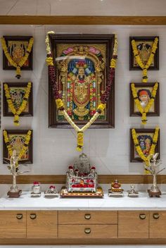 an altar with decorations and pictures on the wall