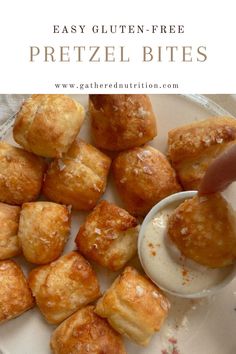 a white plate topped with pastries covered in powdered sugar and being drizzled