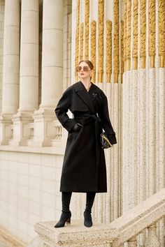 The trench coat showcases a quintessential piece of outerwear with a timeless silhouette. designed with all the classic features, such as a belted waist and a lapel collar, it is presented in a versatile black hue contributing to its originality. Note:*Processing time takes 11-13 working days (including 7-10 working days for manufacturing and NOT including shipping time)**Backorder Definition- The product is low in stock and in case the customer purchased successfully after out stock, the order Black Belted Wool Coat For Fall, Elegant Outerwear With Belt And Lapel Collar, Elegant Black Outerwear With Belted Cuffs, Classic Long Coat With Belt, Classic Black Belted Wool Coat, Black Wool Coat With Belted Cuffs For Winter, Black Belted Outerwear For Formal Occasions, Black Formal Outerwear With Belt, Elegant Long Coat With Belt