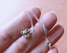 "This dainty necklace is composed of a silver Koala that slides freely along a delicate sterling silver chain that closes with a sterling silver spring ring closure. The necklace will be 18\" long, it is 925 sterling silver chain with a stamp. Great for layering with other delicate necklace or minimalist wear. * charm size: 9mm x 8mm" Lover Necklace, Lovers Necklace, Zoo Animal, 925 Sterling Silver Chain, Silver Spring, Delicate Necklace, Dainty Necklace, Sterling Silver Necklace, Spring Rings