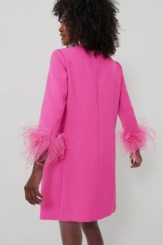 Retro glam meets modern mini with the Mod Mary Dress. This fabulous hot pink number features a wearable silhouette that's elevated by eye-catching details — you can't miss the extraordinary, high-quality feather embellishments on the sleeve cuffs that take this stunner from cool to show-stopping. Perfect for glitzy gatherings and evening events, pair this beauty with heels and metallic accessories for a jaw dropping look. Round neckline Three-quarter length sleeves Feather cuffs Back zip closure Feather Cuffs, Metallic Accessories, Mary Dress, Retro Glam, The Mod, Plus And Minus, Pink Feathers, Metal Accessories, Three Quarter