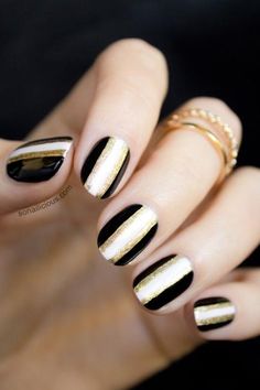 This striped nail design can be formal or casual. For a classic vibe, keep to the simple black-white-and-gold color scheme. #Nails #NailArt خواتم خطوبة, Color Block Nails, New Years Eve Nails, Gold Nail Designs, Fall Nail Art Designs, Easy Nails, Gold Nail, Colorful Nails, Her Nails