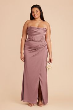 a woman in a strapless purple dress