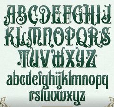 an old fashioned font with green lettering and ornate designs on it's edges,