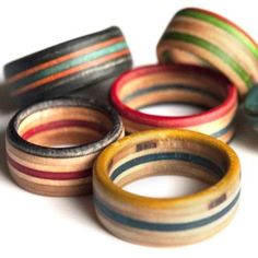 five different colored wooden rings sitting on top of each other