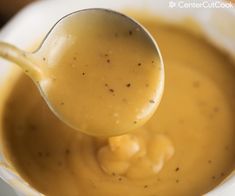 a spoon is being used to stir peanut butter