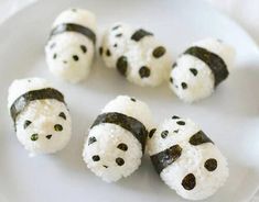 a white plate topped with lots of food covered in black and white frosted icing