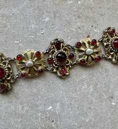 Circa 1800s Beautiful Austro Hungarian Garnet Pearl Gold Sterling Silver Victorian Art Nouveau Antique Bracelet Stunning, Highest of quality Measures 7 inches in length a little over 1 inch wide See  matching necklace in link below  https://www.etsy.com/listing/1682435990/victorian-art-nouveau-austro-hungarian?click_key=4aeb6d2f3fbad4f596876f572e4685baa536afbf%3A1682435990&click_sum=5615c927&ga_search_query=Austro&ref=shop_items_search_58&pro=1&frs=1&sts=1 Vintage Ceremonial Jewelry With Historical Design, Ceremonial Vintage Jewelry With Historical Design, Vintage Baroque Jewelry With Historical Design, Victorian Hallmarked Bracelets For Ceremonial Occasion, Antique Red Bracelet For Formal Occasions, Red Antique Bracelet For Formal Occasions, Victorian Ceremonial Bracelet With Intricate Design, Victorian Filigree Bracelets For Ceremonial Occasions, 1800 Accessories