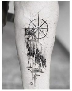 a computer screen with a drawing of a wolf on it's left leg and an image of a compass in the background