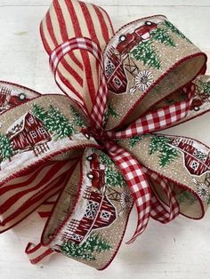 a red and white bow with christmas decorations on it