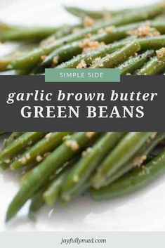 garlic brown butter green beans on a white plate