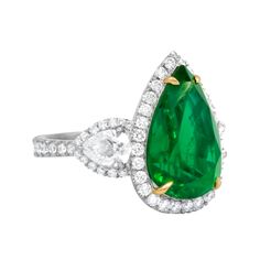 Platinum and 18kt Yellow Gold Emerald Diamond Ring: Centered with an 8.78ct pear-shaped green emerald Accented by 2 pear-shaped GIA certified diamonds (ID: 1215069844) on the side Surrounded by 2.00cts of micropave round diamonds Size: 6 Pear Diamond Ring, Edwardian Engagement Ring, Emerald Ring Vintage, Diamond Rings With Price, Colored Engagement Rings, Platinum Diamond Rings, Antique Diamond Rings, Emerald Diamond Ring, Vintage Style Rings