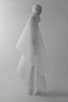 a black and white photo of a woman's dress