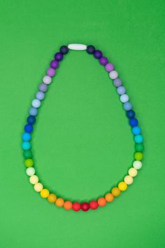 Fun necklace for kids! Wear as a fun rainbow necklace or use for your kid to fidget with or chew! If (and when!) they decide to put it in their mouth, it's 100% safe to chew! RECOMMENDED AGE: 3+ DETAILS: Features a breakaway safety clasp for quick release. 100% food grade silicone beads Free of BPA, PVC, phthalates, lead and cadmium CARE: Wash in warm soapy water Lay flat to dry These necklaces are perfect if your child needs on-the-go oral sensory input. Kidcore Accessories, Rainbow Sensory, Necklace For Kids, Toddler Necklace, Chew Necklace, Sensory Input, Kids Sensory, Rainbow Jewelry, Rainbow Necklace