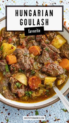 hungarian goulash with potatoes and carrots in a white bowl