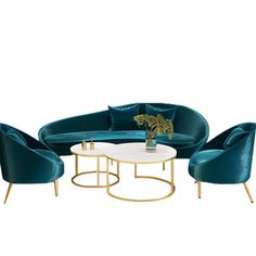 three chairs and a coffee table in blue velvet with gold trim around the legs, on a white background