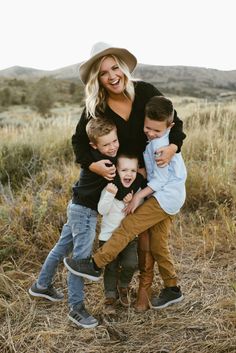 a family posing for a photo in a field