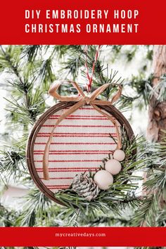 an ornament hanging from a christmas tree with text overlay that reads diy embroidery hoop christmas ornament