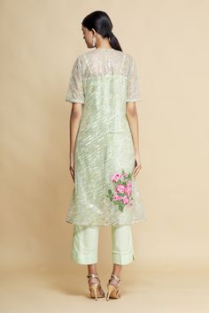 Green kurta with floral, sequin embroidered motifs. Paired with pant, dupatta and camisole.
Component: 4
Embroidered
Neckine: Round
Sleeve Length: Short
Fabric: Organza
Color: Green
Sequin work - Aza Fashions Festive Pant Set With Mirror Work And Straight Kurta, Festive Organza Palazzo Set With Floral Embroidery, Spring Chanderi Salwar Kameez With Mirror Work, Pista Green Straight Kurta Sets For Reception, Festive Straight Kurta Pant Set With Mirror Work, Spring Chanderi Anarkali Set With Mirror Work, Reception Pant Set With Resham Embroidery, Spring Chanderi Palazzo Set With Mirror Work, Pista Green Anarkali Set With Floral Embroidery For Party