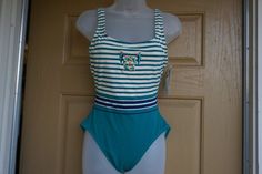 NWT Amber Bay. Size 10 one piece swimsuit 90s. In good vintage condition.17.5" across front armpit to armpit 12" across waist 16" across hips 28" length top of shoulder to crotch Fitted Striped Lined Swimwear, Sleeveless Striped Lined Swimwear, Striped Sleeveless Lined Swimwear, Swimwear 90s, 2000 Clothes, Babydoll Nightgown, Feather Jacket, Sheer Shirt, Fredericks Of Hollywood