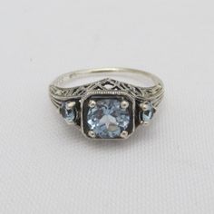 Vintage Sterling Silver Aquamarine Three Stone Filigree Ring...Marked 925...Total of weights 2.7grams.. Size 7...Measure of Face 9.1mm...It's in good condition Filigree Ring, Domed Ring, Pinky Ring, Ring Size 7, Three Stone, Sterling Silber, Promise Rings, Vintage Sterling Silver, Aquamarine