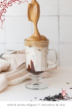 a cup filled with chocolate and whipped cream