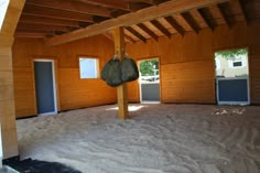 an empty room with wood paneling and white snow on the floor is seen in this image