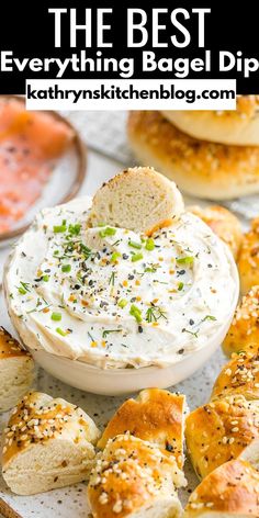 the best everything bagel dip recipe is in a white bowl with bread slices and sprinkles around it