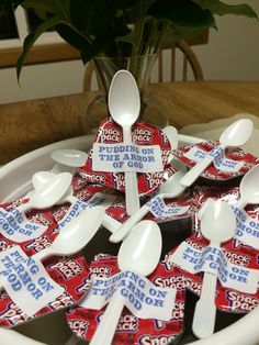 a bowl filled with lots of spoons sitting on top of a table