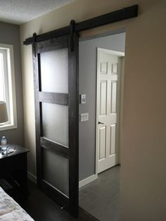 a bedroom with a sliding glass door in it