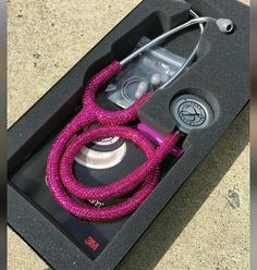 a pink rope in a black box with a camera attached to the top and side