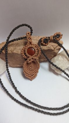 A beautiful Goddess pendant made with a Red Jasper cabochon accented with light caramel and gray hemp cord. Each order comes packed in a 100% cotton muslin bag ready for gifting! Pendant size: 3 1/2" x 1 1/4" Necklace length: 32" max, adjustable Handmade Brown Cord Jewelry, Orange Macrame Jewelry As Gift, Adjustable Orange Macrame Jewelry, Earthy Brown Waxed Cord Necklaces, Earthy Brown Waxed Cord Necklace, Unique Brown Macrame Necklace, Earthy Brown Macrame Jewelry, Artisan Brown Necklace With Waxed Cord, Brown Macrame Nature-inspired Jewelry