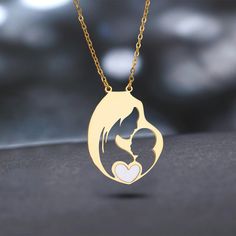 Celebrate the unbreakable bond between mother and child with our "Mother's Embrace" Heart Pendant Necklace. Crafted from durable stainless steel, this necklace features a poignant silhouette of a mother and her child within a heart, symbolizing love and connection. This piece is designed not just as a beautiful accessory but as a celebration of motherhood's nurturing spirit. Perfect for Mother's Day, as a gift for new mothers, or as a token of appreciation, this necklace is a daily reminder of love and familial bonds. Its stainless steel composition ensures a lasting shine and resilience, suitable for everyday wear. We stand behind our jewelry, offering a lifetime guarantee to ensure you feel confident and secure in your purchase. High-Quality Craftsmanship: Our commitment to quality is ev Adjustable Stainless Steel Necklace For Mother's Day, Mother's Day Heart Pendant Necklace In Stainless Steel, Stainless Steel Heart Pendant Necklace For Mother's Day, Mother's Day Stainless Steel Necklace For Mom, Mother's Day Stainless Steel Heart Pendant Necklace, Mother's Day Gift Stainless Steel Necklace, Personalized Stainless Steel Heart Necklace For Mother's Day, Mother's Day White Stainless Steel Necklaces, White Stainless Steel Necklaces For Mother's Day