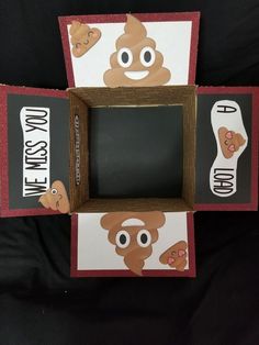 two cardboard boxes with faces and words on them