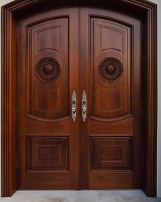 two wooden doors with ornate carvings on the front and side panels, both in dark wood