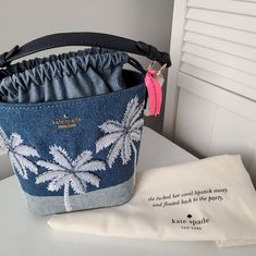 Take It To The Tropics! Rare, Kate Spade, Denim Bucket Handbag With Embroidered And Embellished Palm Trees. Can Be Used As A Satchel With Its Single Strap, Or Use As A Crossbody. Gold Tone Hardware. Comes With Removable Crossbody Strap And Dust Bag. Measures Approx. 8 1/2"H X 5 5/8"W X 4 5/8"D Closure: Drawstring Crossbody Strap Drop Adjustable Approx: 18 3/4" - 24 3/4" Single Satchel Strap Drop Approx. 3 1/2" Condition: New With Tags Kate Spade Spring Bags For On-the-go, Summer Kate Spade Bags For Daily Use, Red Crossbody Bag, Bucket Handbags, Pink Crossbody Bag, Black Crossbody Purse, Kate Spade Purse, Leather Bucket Bag, Leather Bucket