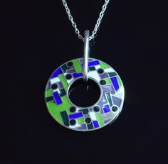 Handmade Round Silver Pendant with Multicolour Champleve Enamel - Unique Geometry Pattern. Introducing our exquisite Round Silver Pendant featuring a stunning Multicolour Champleve Enamel design with a captivating geometry pattern. This luxurious pendant is meticulously handcrafted with intricate details, showcasing a vibrant blend of colors and shapes that will surely make a statement. Elevate your look with this unique and artistic piece that effortlessly combines elegance and modern style. Pe Geometry Pattern, Polish Silver, Armenia, Intricate Details, Chain Lengths, Body Lotion, Pendant Necklaces, Silver Pendant, Geometry