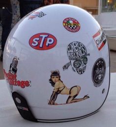 a white helmet with stickers on it