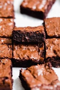 chocolate brownies cut into squares on a white surface