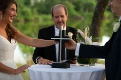 the bride and groom are exchanging their wedding vows