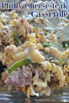 a close up of a plate of food with pasta and meat on it, text reads philly cheese steak casserole