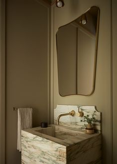 a bathroom sink with a mirror above it