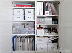 an organized closet with white shelving and lots of crafting supplies on the shelves