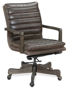 a brown leather office chair sitting on top of a wooden desk