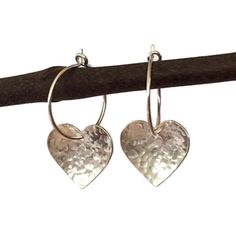 "Simple yet stylish sterling silver hoop earrings featuring a beautiful hand hammered heart. They will add a lovely touch to any outfit  and will make an ideal valentines or anniversary gift. Total length: approximately 2.5 cm (0.9\") Heart: 1.5 cm (0.5\") x 1.3 cm (0.5\") Hoop size: 1.5 cm (0.5\") in diameter x 0.7mm thick. The earrings will come in a beautiful gift box." Silver Small Hoop Heart Earrings For Anniversary, Nickel Free Small Hoop Heart Earrings For Anniversary, Silver Hoop Earrings With Heart Charm For Anniversary, Sterling Silver Small Hoop Heart Earrings For Gift, Sterling Silver Double Heart Hoop Earrings For Gifts, Silver Small Hoop Heart Earrings As Gift, Silver Small Hoop Heart Earrings For Gift, Silver Open Heart Hoop Earrings As Gift, Nickel-free Small Hoop Heart Earrings For Anniversary