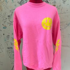 Hot Pink Smiley Face Sweatshirt With Lightning Bolts On The Sleeves! Small Imperfections In The Lightning Bolt Printing (See Photos) But They Are Not Noticeable Unless You Look Very Closely. Super Soft Sweatshirt And Perfectly Trendy! Trendy Pink Smiley Face Tops, Pink Crew Top For Spring, Pink Crew Neck Top For Spring, Trendy Spring Crew Neck Tops, Trendy Crew Neck Top For Spring, Spring Crew Neck Top With Smiley Face, Spring Smiley Face Crew Neck Top, Casual Smiley Face Top For Fall, Trendy Fall Tops With Smiley Face