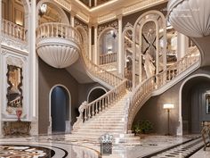 a large staircase in the middle of a room with chandeliers on either side