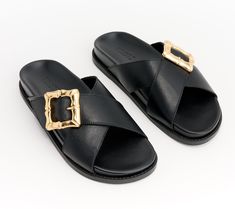 Pair your wide-leg jumpsuit or athleisure ensemble with these chic flatforms and show off the crossband design and luxe buckle detail. From Schutz. Luxury Summer Slides With Buckle Closure, Chic Luxury T-strap Sandals With Buckle Closure, Black Leather Sandals With Gold-tone Hardware, Chic Black T-strap Sandals With Buckle Closure, Luxury Leather T-strap Sandals With Buckle Closure, Leather Slide Sandals, Leather Slides, Work Style, Wide Leg Jumpsuit