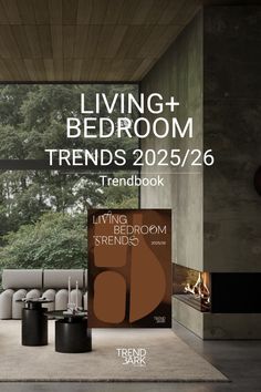 the living room and bedroom trend book is on display in front of a large window